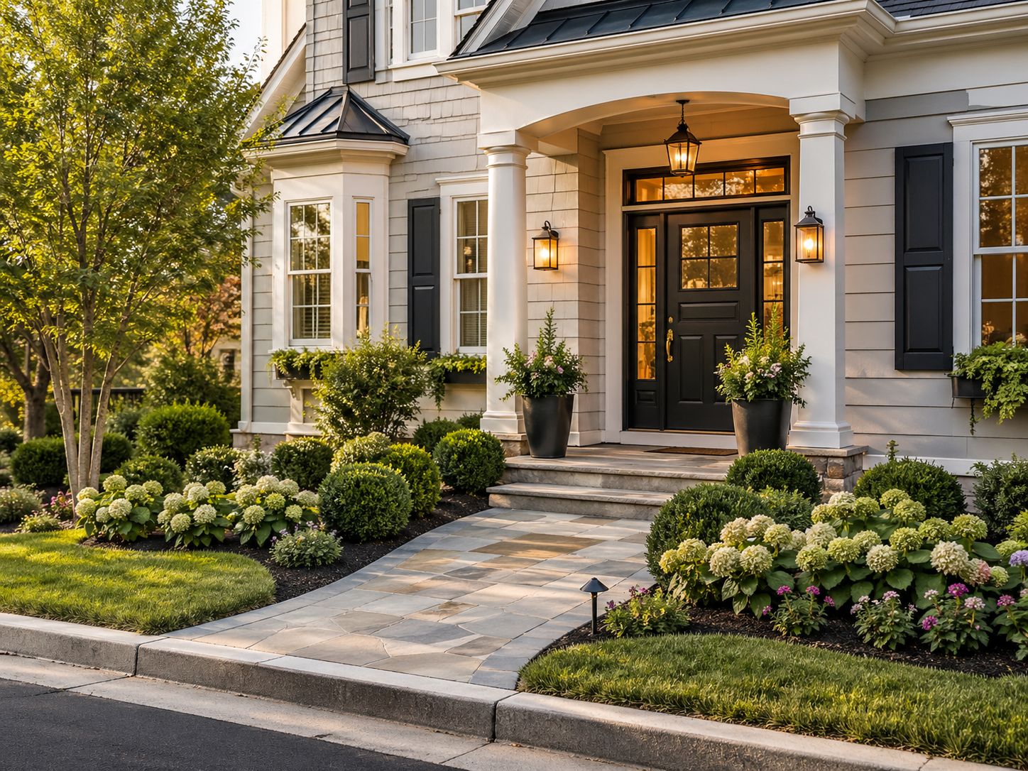 DFW residential entryway with upgraded front door, sidelights, warm exterior lighting, walkway, and landscaping.